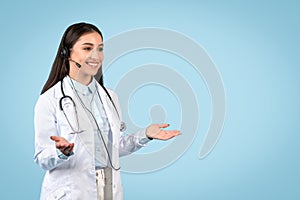 Woman doctor with headset ready for teleconsultation