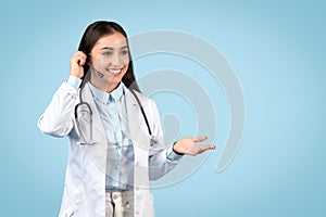 Woman doctor with headset ready for teleconsultation photo