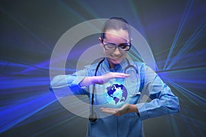 The woman doctor holding earth in globalisation concept