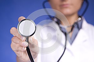 Woman doctor holding stethoscope. Nurse