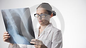 Woman doctor looking at chest x-ray