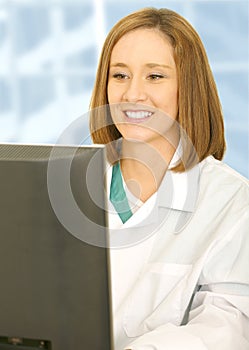 Woman Doctor Looking At Her Computer