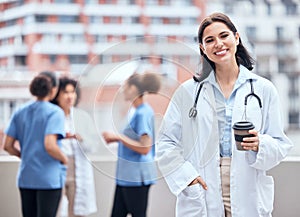 Woman, doctor and portrait of happy coffee break, outdoor and relax at hospital, clinic or colleagues on rooftop