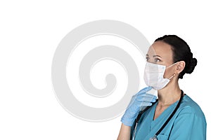 Woman doctor in profile in medical clothes. White background. Copy space