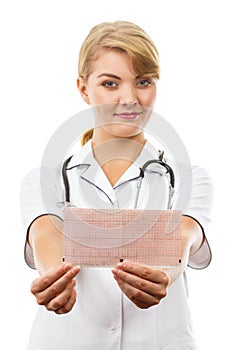 Woman doctor with stethoscope holding electrocardiogram graph, healthcare concept