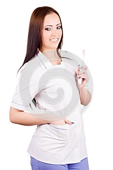 Woman doctor with toothbrush in hand