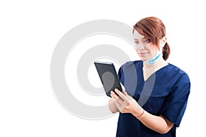 Woman doctor using tablet on white copyspace