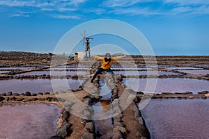 Woman does funny poses in the Salinas de Pozo Izquierdo. Aguimes. Gran Canaria. Las Palmas. Canary Islands. 3