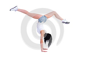 Woman does a gymnastic handstand