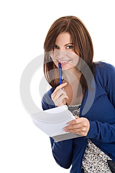 Woman does records by pen in notepad