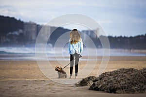 Woman with dog on beach