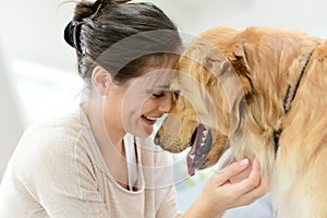 Woman and dog cuddling