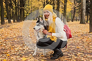 Woman and dog husky outdoor