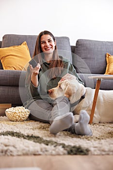 Woman and dog watching TV