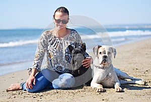 Woman and dogs on the beach