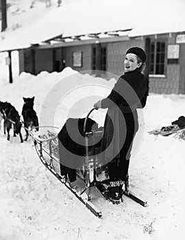 Woman on dogsled