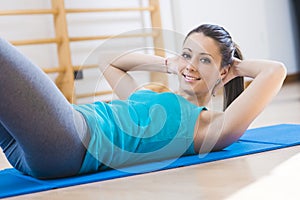 Woman doing abs workout at gym