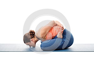 Woman doing asana Yoga mudrasana