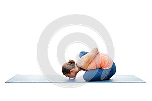 Woman doing Ashtanga Vinyasa Yoga asana Marichyasana B