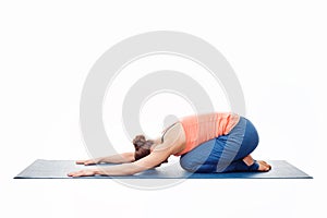 Woman doing Ashtanga Vinyasa Yoga relaxation asana Balasana chil