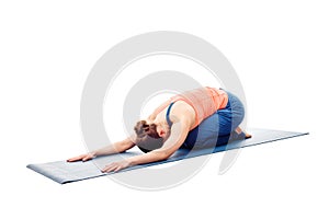 Woman doing Ashtanga Vinyasa Yoga relaxation asana Balasana chil