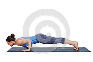 Woman doing Ashtanga Vinyasa yoga Surya Namaskar Sun Salutation