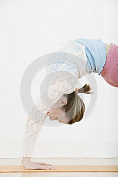 Woman Doing Back Bend On Mat