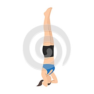 Woman doing Bound headstand pose or Buddha hasta sirsasana exercise