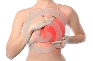 Woman doing breast self-examination on white background.