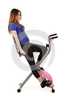 Woman doing cardio on an exercise bike