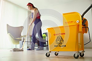 Woman Doing Chores Cleaning Floor At Home Focus on Bucket