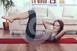 Woman Doing Core Muscles Exercises at Home.
