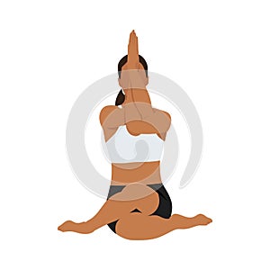 Woman doing cow face pose with eagle arms gomukhasana garudasana