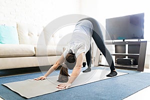 Woman doing downward dog yoga pose