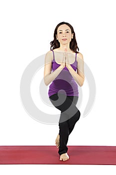 Woman doing Eagle pose in yoga