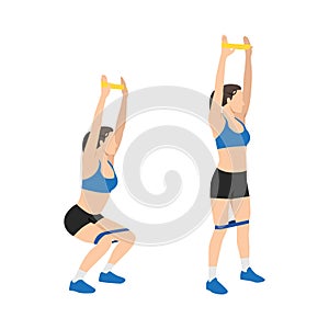 Woman doing Elastic band overhead squad exercise.