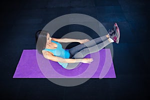 Woman doing excercise on yoga mat