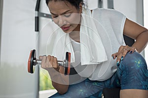 Woman doing exercise with dumbbells