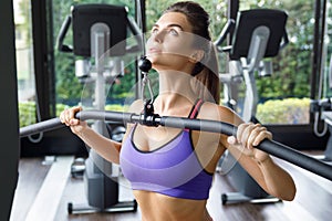 Woman doing exercise for her back - Lat pulldown