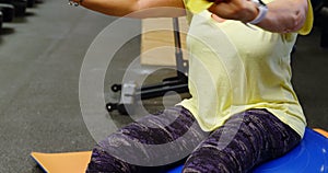 Woman doing exercise with resistance band 4k