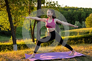 Woman doing exercise to keep fit in the park