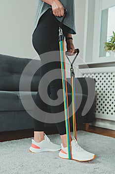 Woman doing exercises with resistance bands