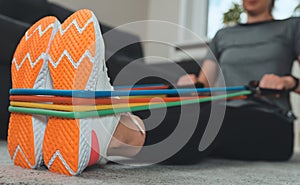 Woman doing exercises with resistance bands