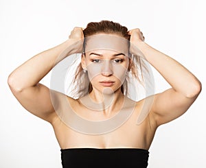 Woman doing face fitness, aging chang in the muscles of the face. beauty and health concept
