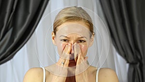 Woman doing face fitness, aging chang in the muscles of the face. strengthening of the upper and lower eyelid