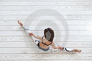 Woman doing fit exercise on white flooring