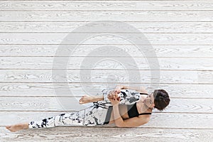 Woman doing fit exercise on white flooring