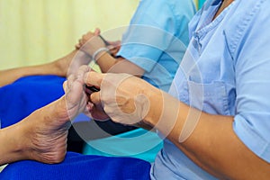 Woman Doing Foot Massage Health Care Treatment in the Spa