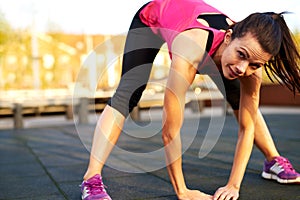 Woman doing a full body stretch and smile.