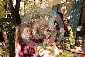 Woman doing grocery shopping at local farmers market